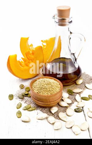 Flour pumpkin in bowl on white wooden board Stock Photo
