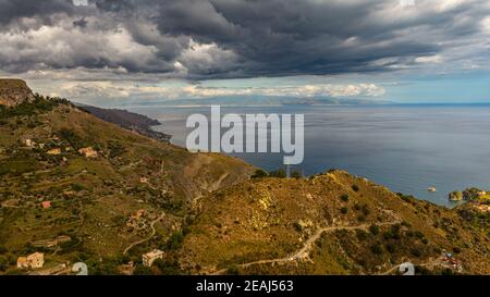 between sky and sea black clouds. Stock Photo