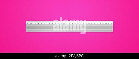 Metal ruler isolated on pink background Stock Photo