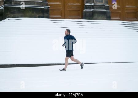 Edinburgh, Scotland, UK. 10th Feb 2021. Due to a heavy snowfall Edinburgh city center  was halted at a standstill this morning. A but is seen stuck in the snow in Edinburgh city centre. Credit: Lorenzo Dalberto/Alamy Live News