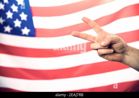 American flag with victory sign Stock Photo