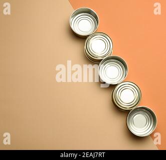 empty metal can for canned fish on a brown background Stock Photo