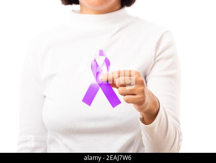 Young woman holding purple ribbon on hand Stock Photo