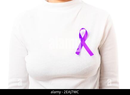 Young woman stick purple ribbon on the chest Stock Photo