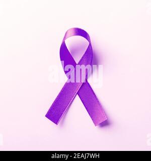 Purple ribbon symbol of Pancreatic cancer awareness Stock Photo