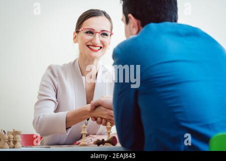 Businesswoman winning in chess due to better strategy Stock Photo