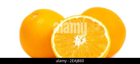 Two whole oranges and half an orange isolated on a white background Stock Photo