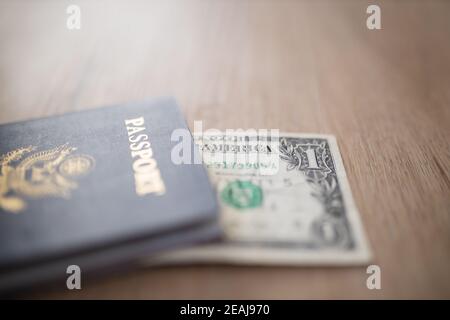 One-Dollar Bill Under a United States of America Passport Stock Photo