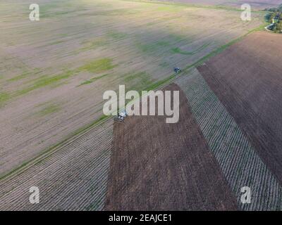 Top view of the tractor that plows the field. disking the soil. Soil cultivation after harvest Stock Photo