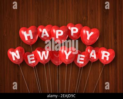 Red happy new year heart shaped air balloons on a dark wooden background Stock Photo