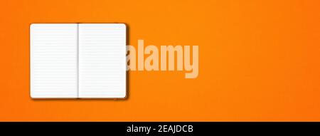 Orange open lined notebook isolated on colorful background. Horizontal banner Stock Photo