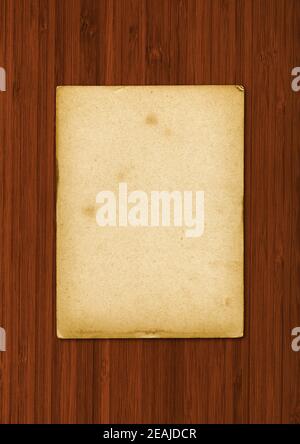 Old parchment paper texture isolated on wooden background Stock Photo