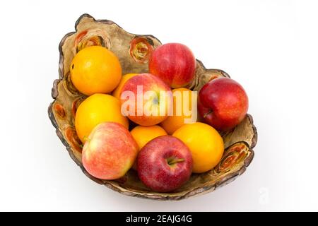 fresh fruits in a clay bowl Stock Photo