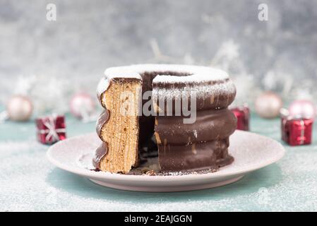 Traditional german christmas chocolate cake called Baumkuchen, winter season sweets Stock Photo