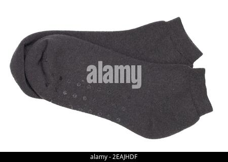 Socks isolated. Closeup of a pair of black warm wool socks for cold winter isolated on a white background. Macro photgraph. Stock Photo