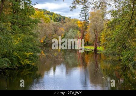 River Glan surrounded with multi colored trees Stock Photo