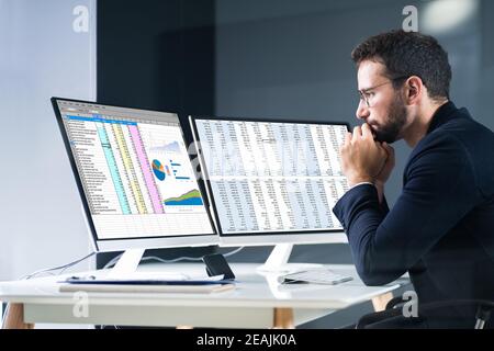 Analyst Employee Using Spreadsheet Stock Photo