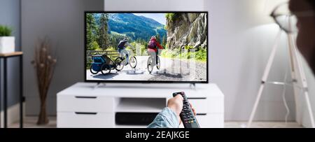 Watching TV Movie On Couch Stock Photo