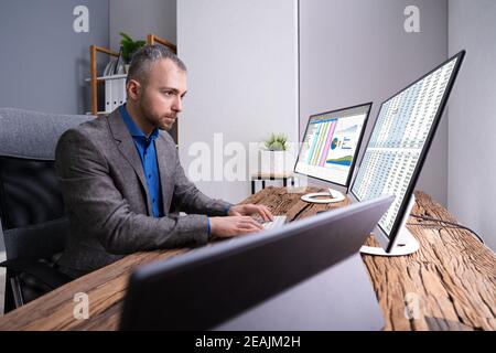Analyst Employee Working With Spreadsheet Stock Photo