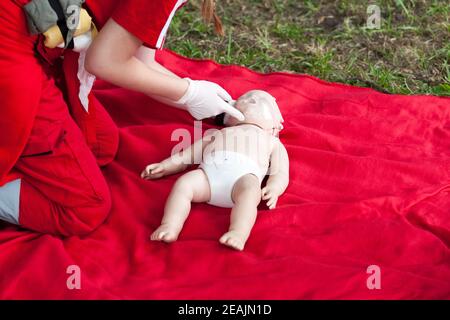 Baby CPR dummy first aid training Stock Photo