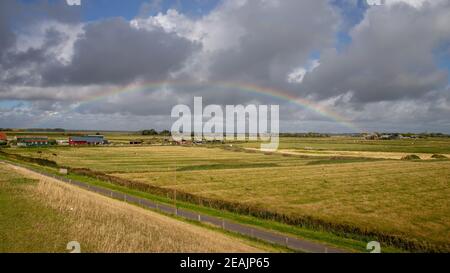 Rainbow over Westerhever Stock Photo