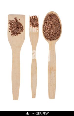 Wooden spoon, fork, paddle with  flax seed Stock Photo