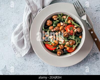 Salad with arugula, mini champignons Stock Photo