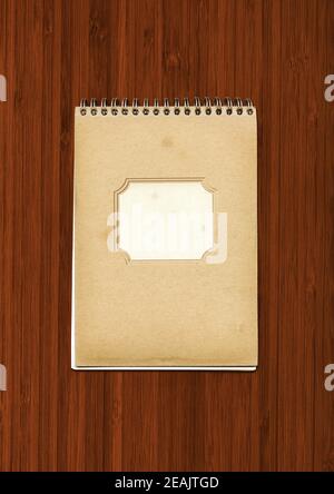 Vintage spiral close notebook on dark wooden background Stock Photo