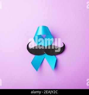 Black mustache paper and light blue ribbon Stock Photo