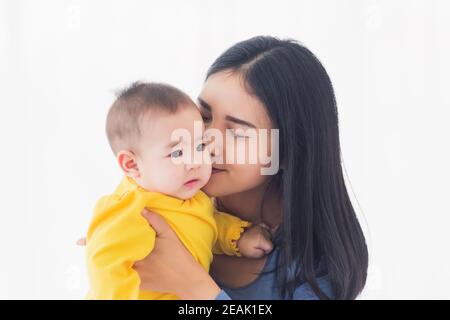 mother holding his newborn little baby in her arms Stock Photo