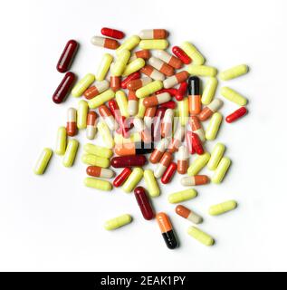 Top view of pile of pills against white background Stock Photo