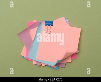 stack of colorful stickers on green background Stock Photo