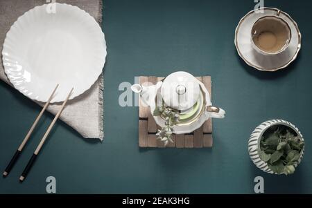 Empty white plate, chopsticks and herbal tea Stock Photo
