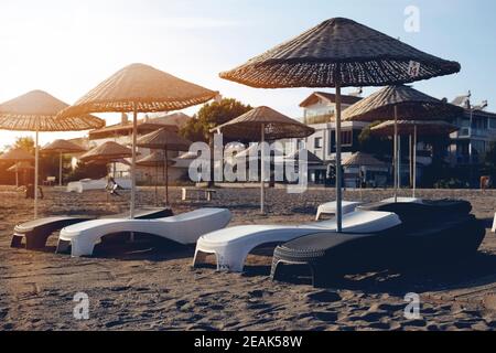 Relax under parasol on the beach of Aegean, Greece Stock Photo