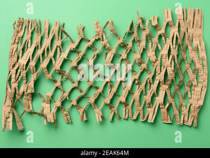 abstract green texture with cut honeycomb brown corrugated paper Stock Photo