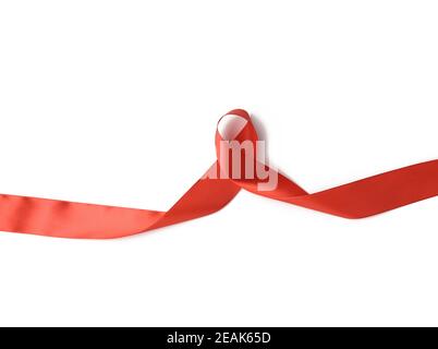 twisted red ribbon isolated on white background Stock Photo