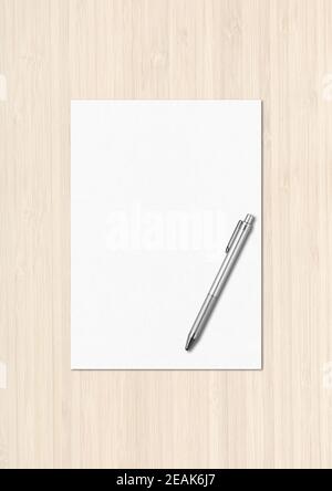 Blank White A4 paper sheet and pen mockup template on white wooden background Stock Photo