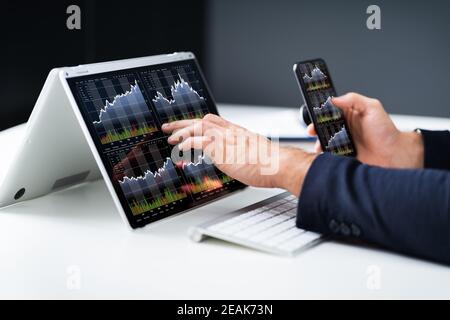 Stock Exchange Business Analyst Using Computer Stock Photo