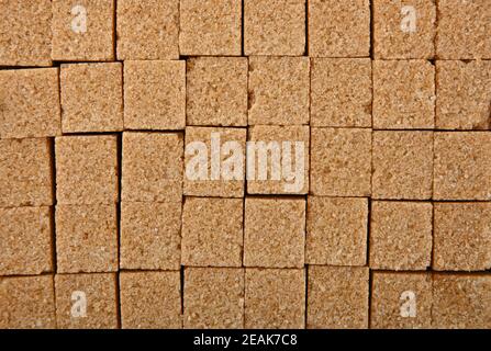 Background texture pattern of brown sugar cubes Stock Photo