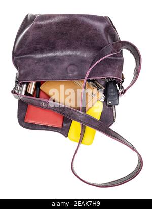 leather bag with scattered contents isolated Stock Photo