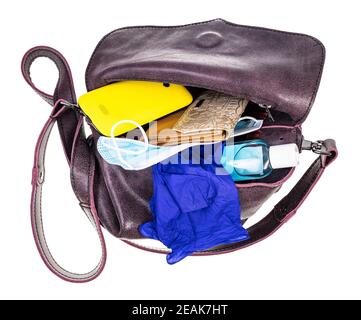 ladies bag with protective items and smartphone Stock Photo