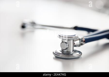 Medical stethoscope or phonendoscope on white table. Acoustic medical device for auscultation Stock Photo