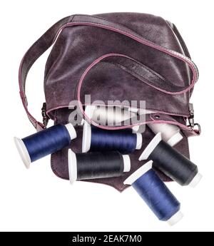spools of sewing threads fell out from women's bag Stock Photo