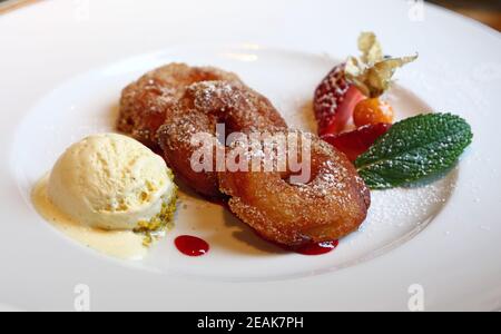 Portion of deep fried battered sweet apple rings Stock Photo