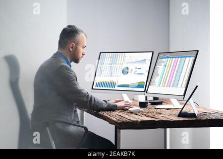 Analyst Employee Working With Spreadsheet Stock Photo