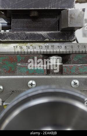 Old yellow lathe machine with a lot of handles. Stock Photo