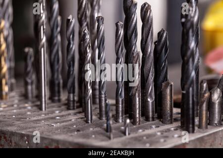 Big set of metal drills of different sizes. Stock Photo