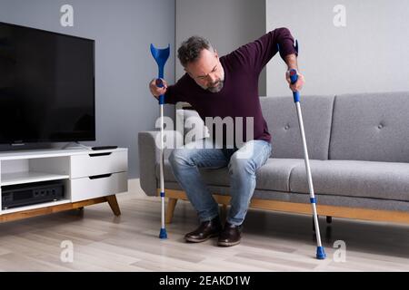 Man With Broken Leg After Accident Stock Photo