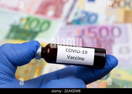 Vaccine against covid-19 on the background of European money Stock Photo