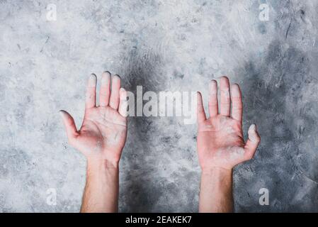 Man hands covered with paint Stock Photo